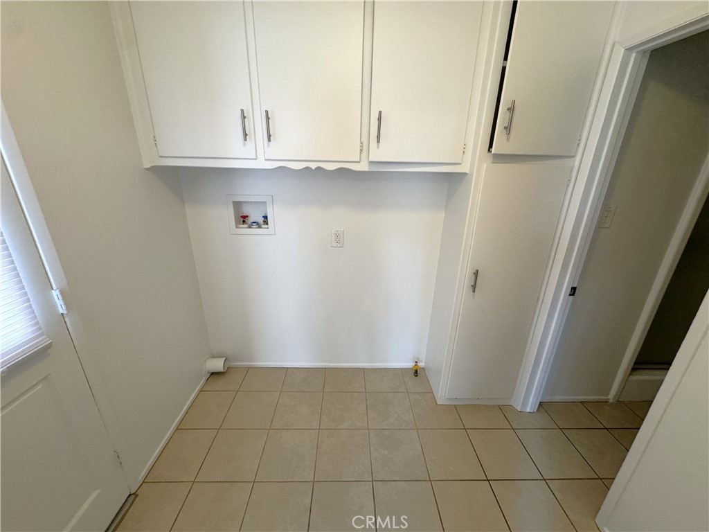 44450 Lowtree Avenue Lancaster, CA 93534 - Photo 10 of 24 a view of an empty room and cabinet