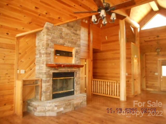 524 Freemantown Road Rutherfordton, NC 28139 - Photo 9 of 43 a view of a fireplace with a door and wooden floor