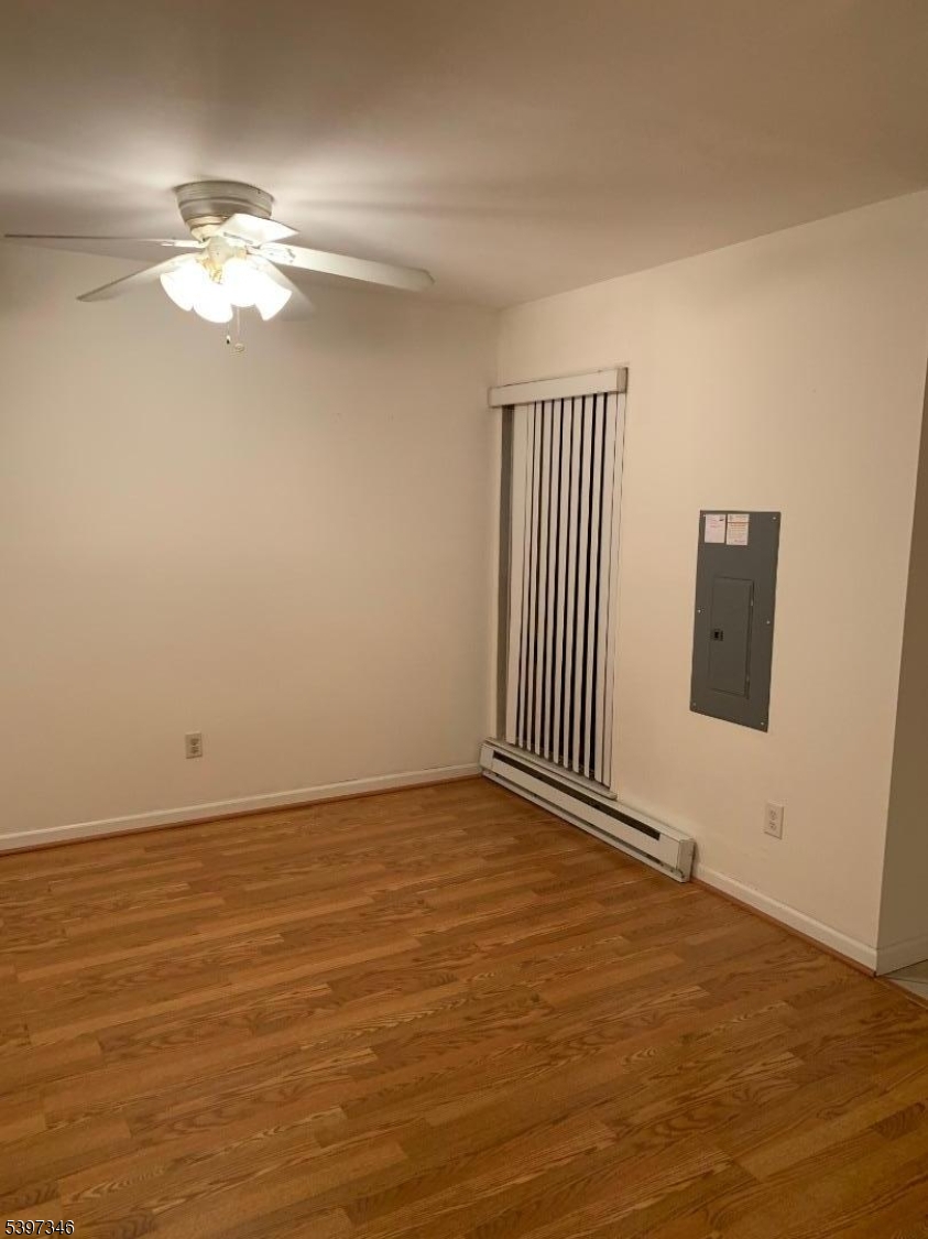 597 Auten Road Hillsborough, NJ 08844 - Photo 2 of 9 a view of a livingroom with a ceiling fan and window
