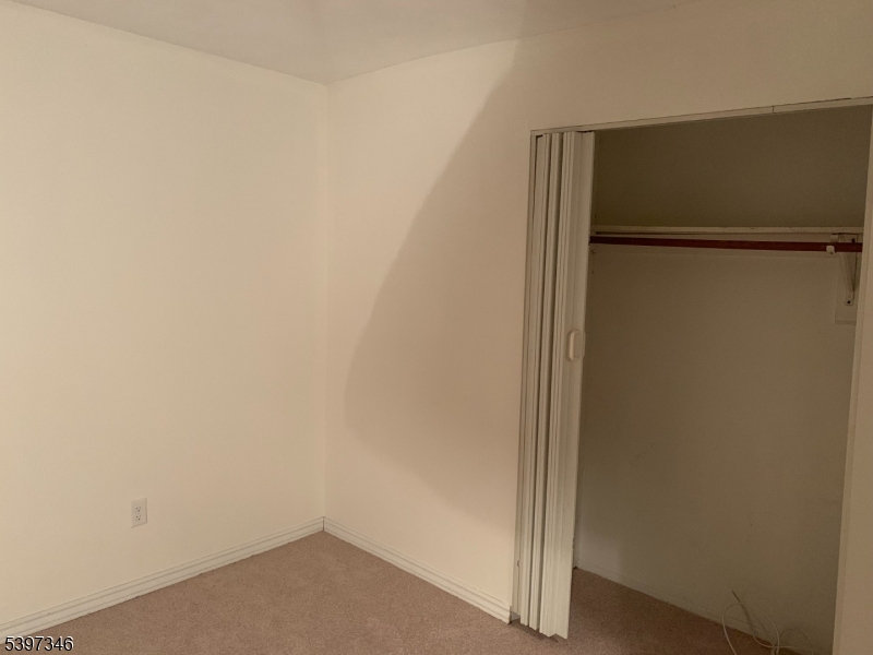 597 Auten Road Hillsborough, NJ 08844 - Photo 4 of 9 a view of walk in closet with empty racks