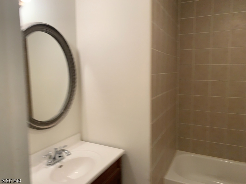 597 Auten Road Hillsborough, NJ 08844 - Photo 7 of 9 a bathroom with a sink a toilet and a mirror