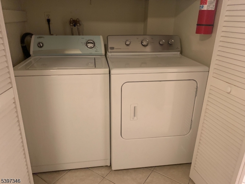 597 Auten Road Hillsborough, NJ 08844 - Photo 8 of 9 a utility room with dryer and washer
