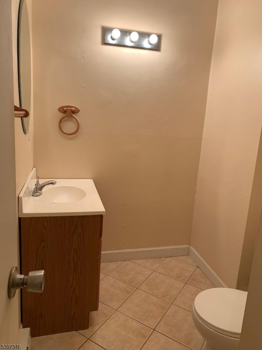 597 Auten Road Hillsborough, NJ 08844 - Photo 9 of 9 a bathroom with a sink a toilet and a mirror
