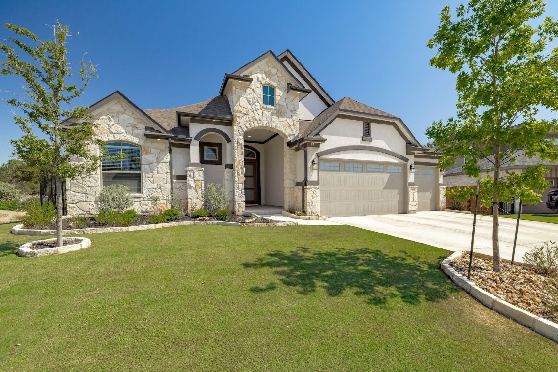 a front view of a house with a yard