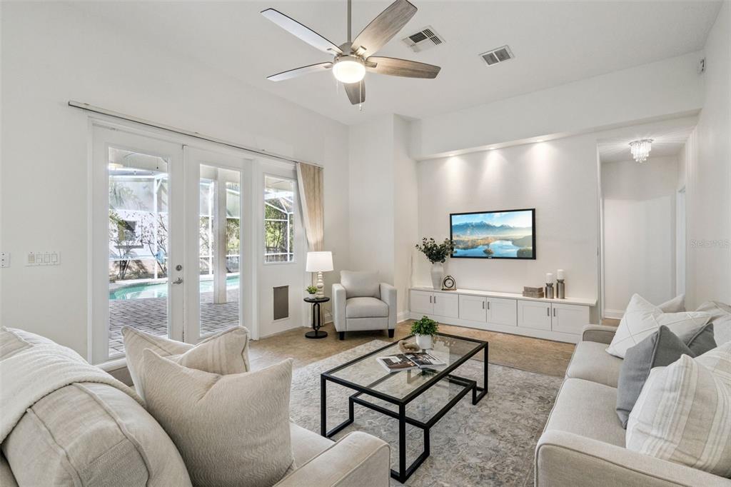 2541 Teton Stone Run Orlando, FL 32828 - Photo 7 of 82 a living room with furniture and a large window