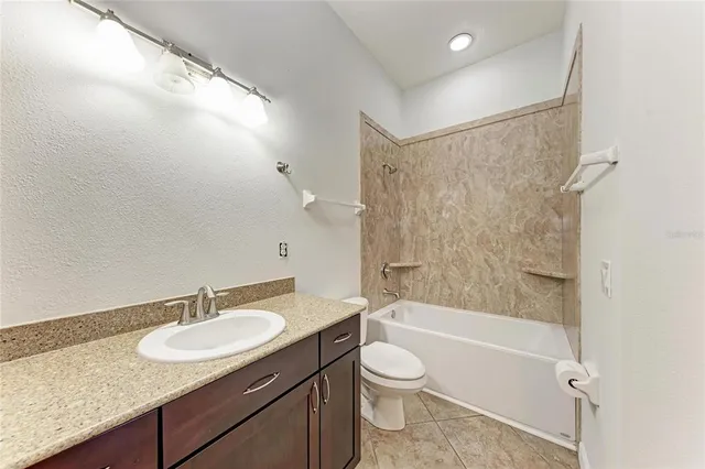 a view of a backyard with swimming pool