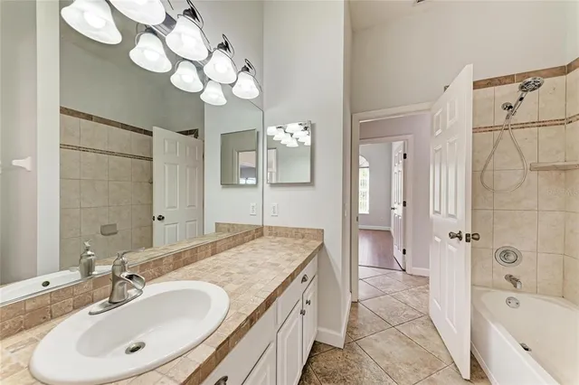 an aerial view of a houses with a lake view