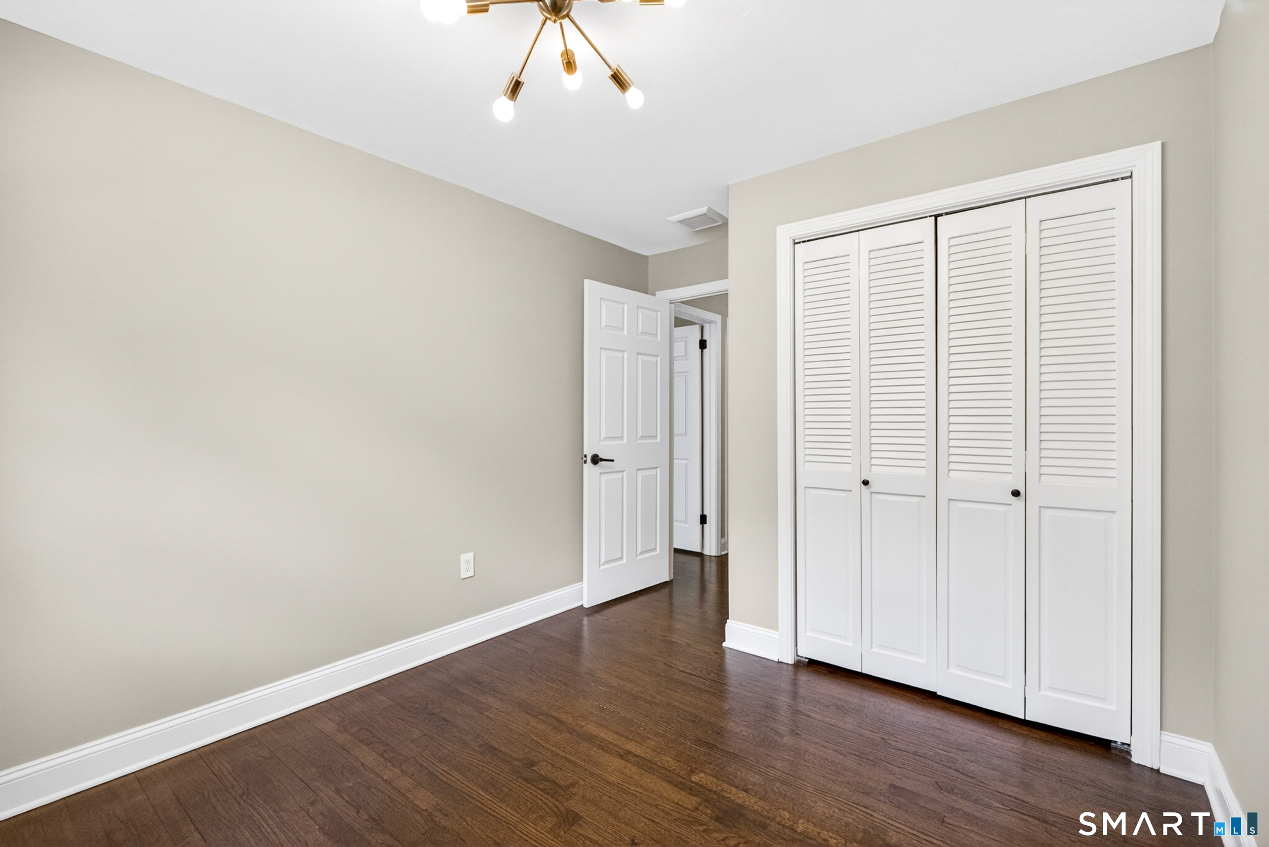 568 Wiese Road Cheshire, CT 06410 - Photo 24 of 40 a view of an empty room with wooden floor