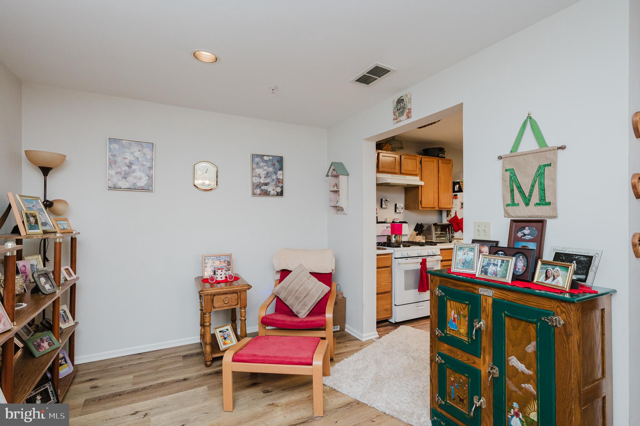 606 Churchill Road, Unit E Bel Air, MD 21014 - Photo 13 of 29 a living room with furniture a rug and a wooden floor