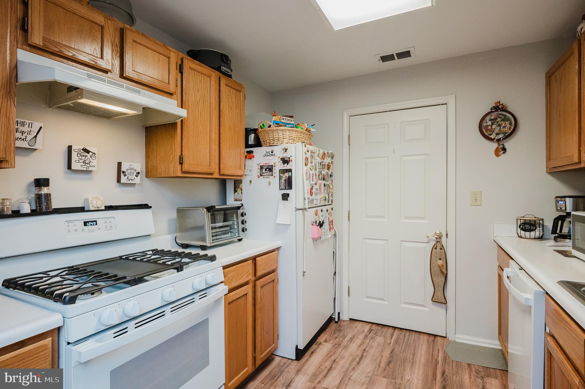 606 Churchill Road, Unit E Bel Air, MD 21014 - Photo 19 of 29 a kitchen with granite countertop a stove and a refrigerator