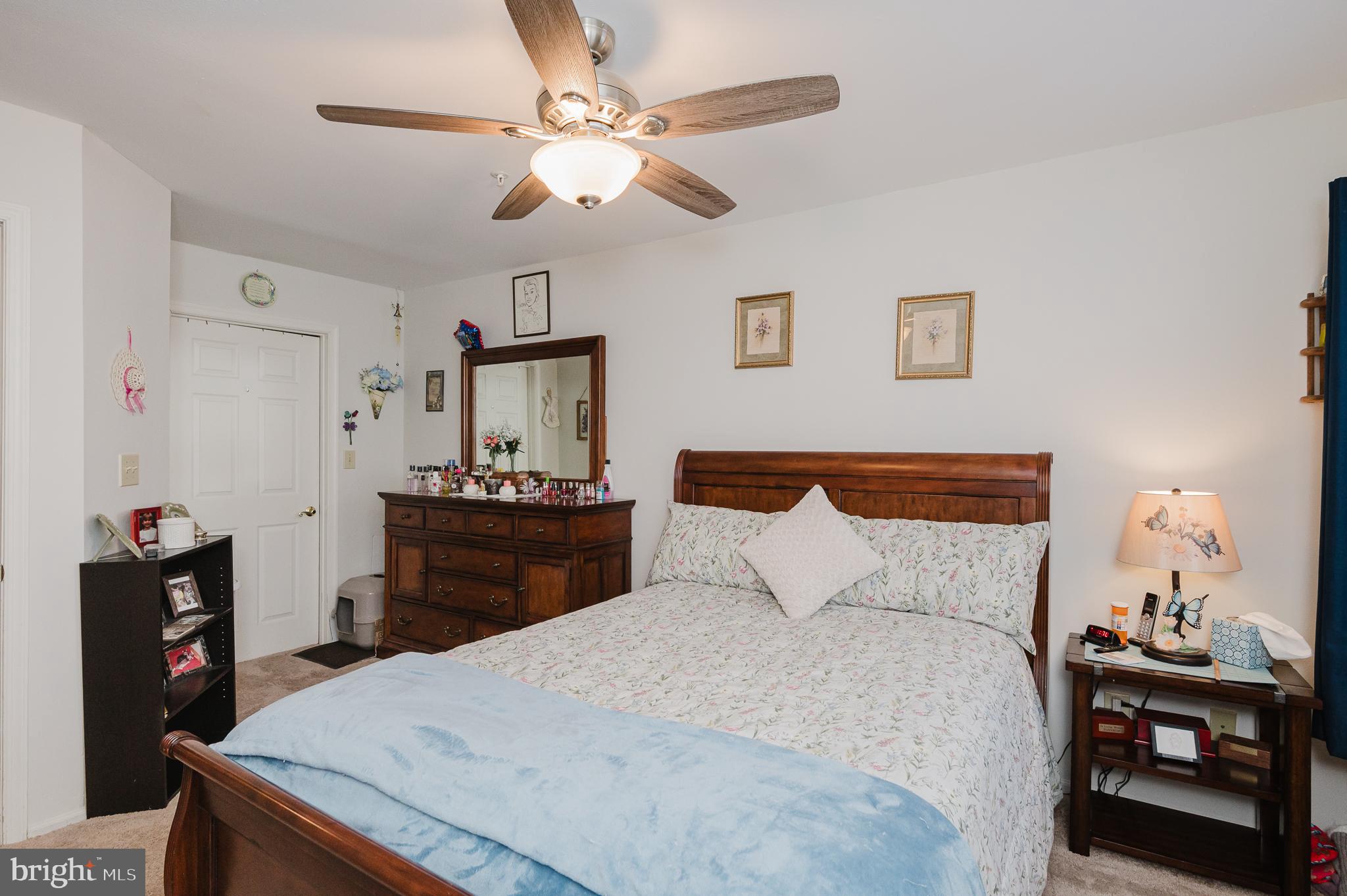 606 Churchill Road, Unit E Bel Air, MD 21014 - Photo 25 of 29 a bedroom with a bed and a chandelier