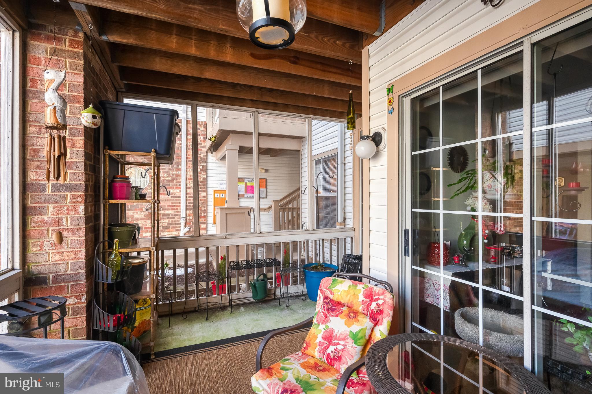 606 Churchill Road, Unit E Bel Air, MD 21014 - Photo 28 of 29 a balcony view with two chairs and a large window