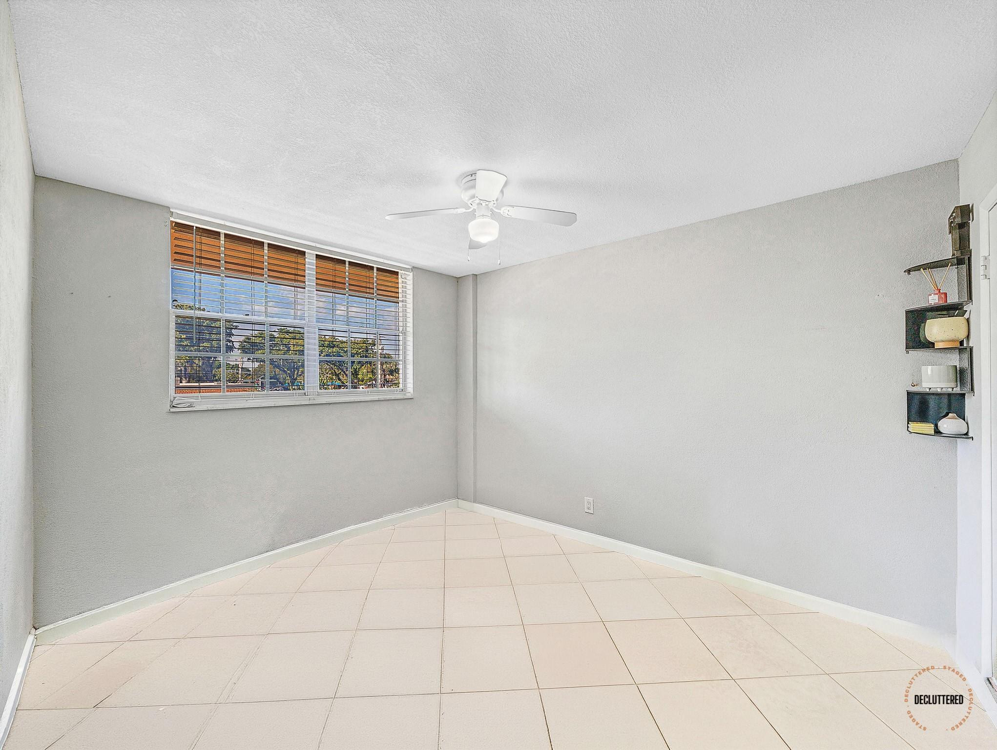 4500 North Federal Highway, Unit 303 Lighthouse Point, FL 33064 - Photo 14 of 40 a view of an empty room with a window