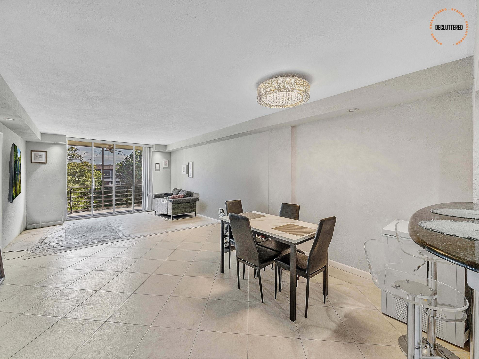 4500 North Federal Highway, Unit 303 Lighthouse Point, FL 33064 - Photo 17 of 40 a view of a livingroom with furniture and a window