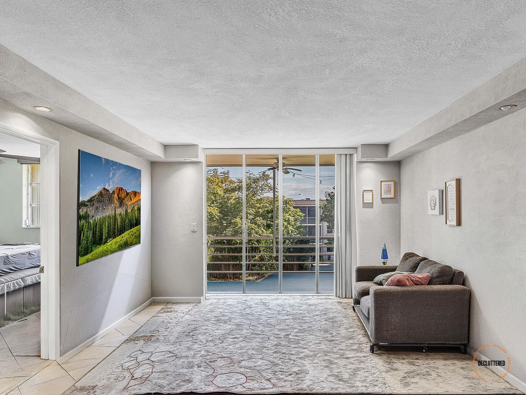 4500 North Federal Highway, Unit 303 Lighthouse Point, FL 33064 - Photo 18 of 40 a living room with furniture and a gate