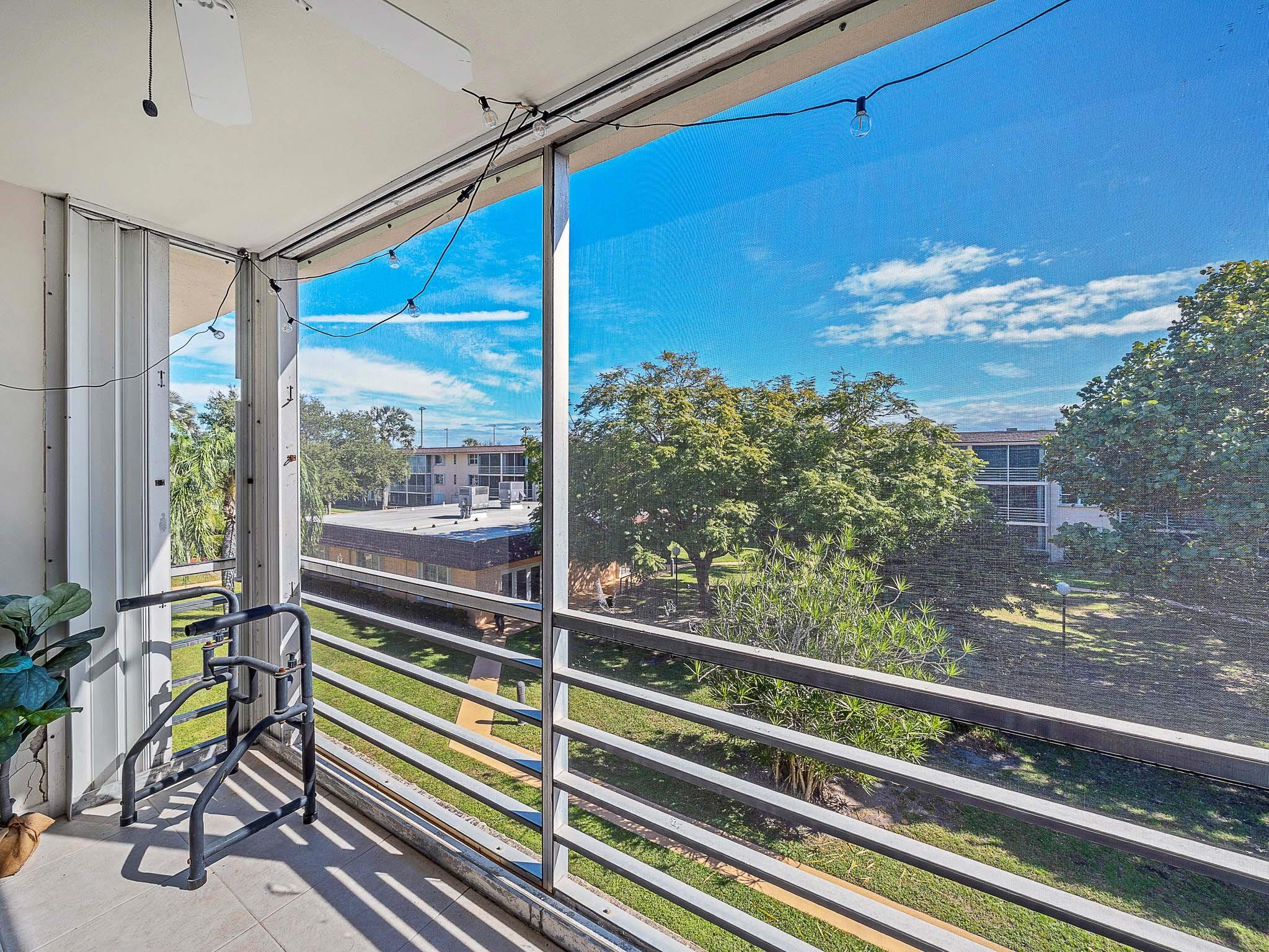 4500 North Federal Highway, Unit 303 Lighthouse Point, FL 33064 - Photo 21 of 40 a view of a balcony with chair and table