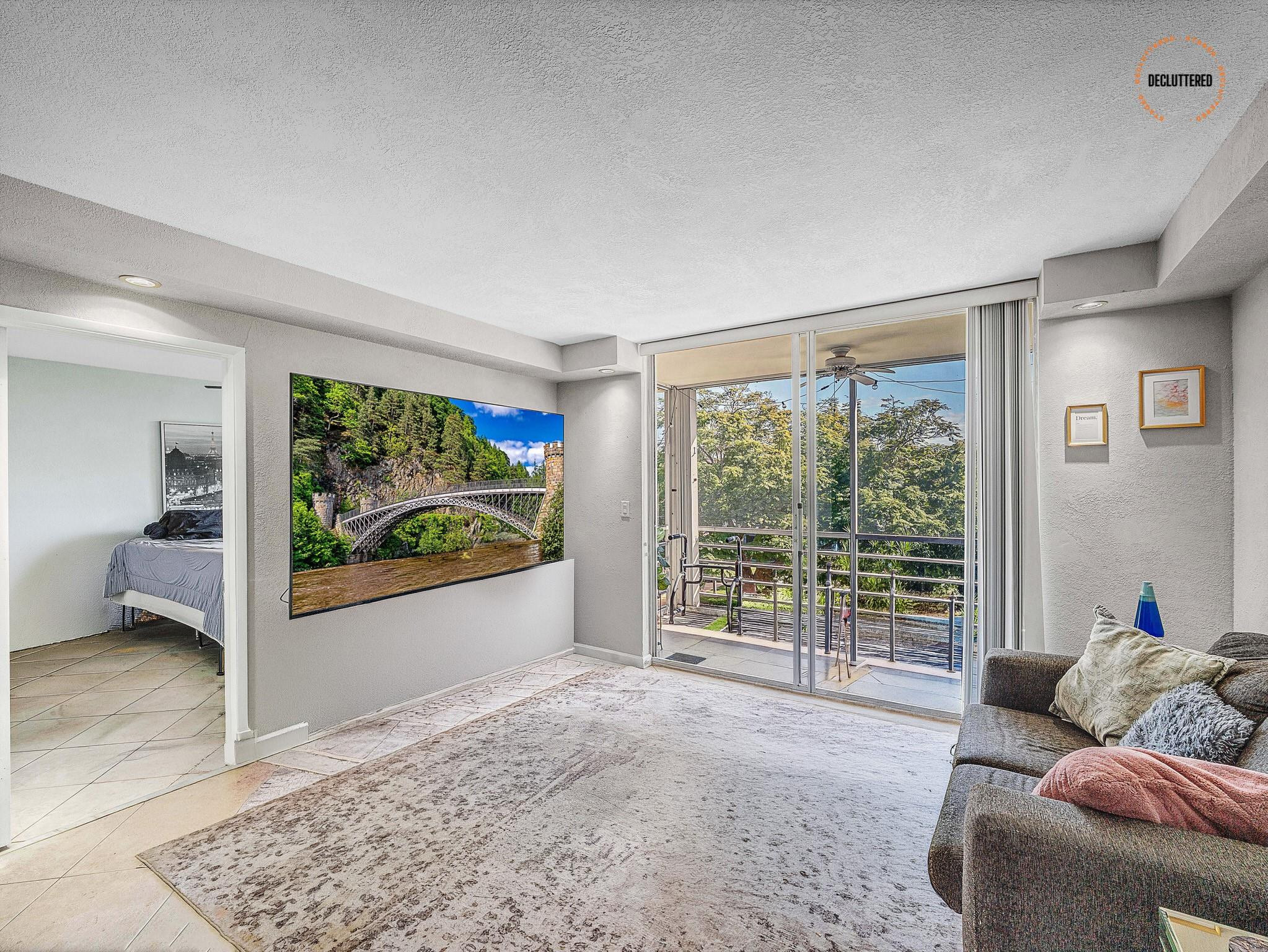 4500 North Federal Highway, Unit 303 Lighthouse Point, FL 33064 - Photo 23 of 40 a living room with furniture and a large window