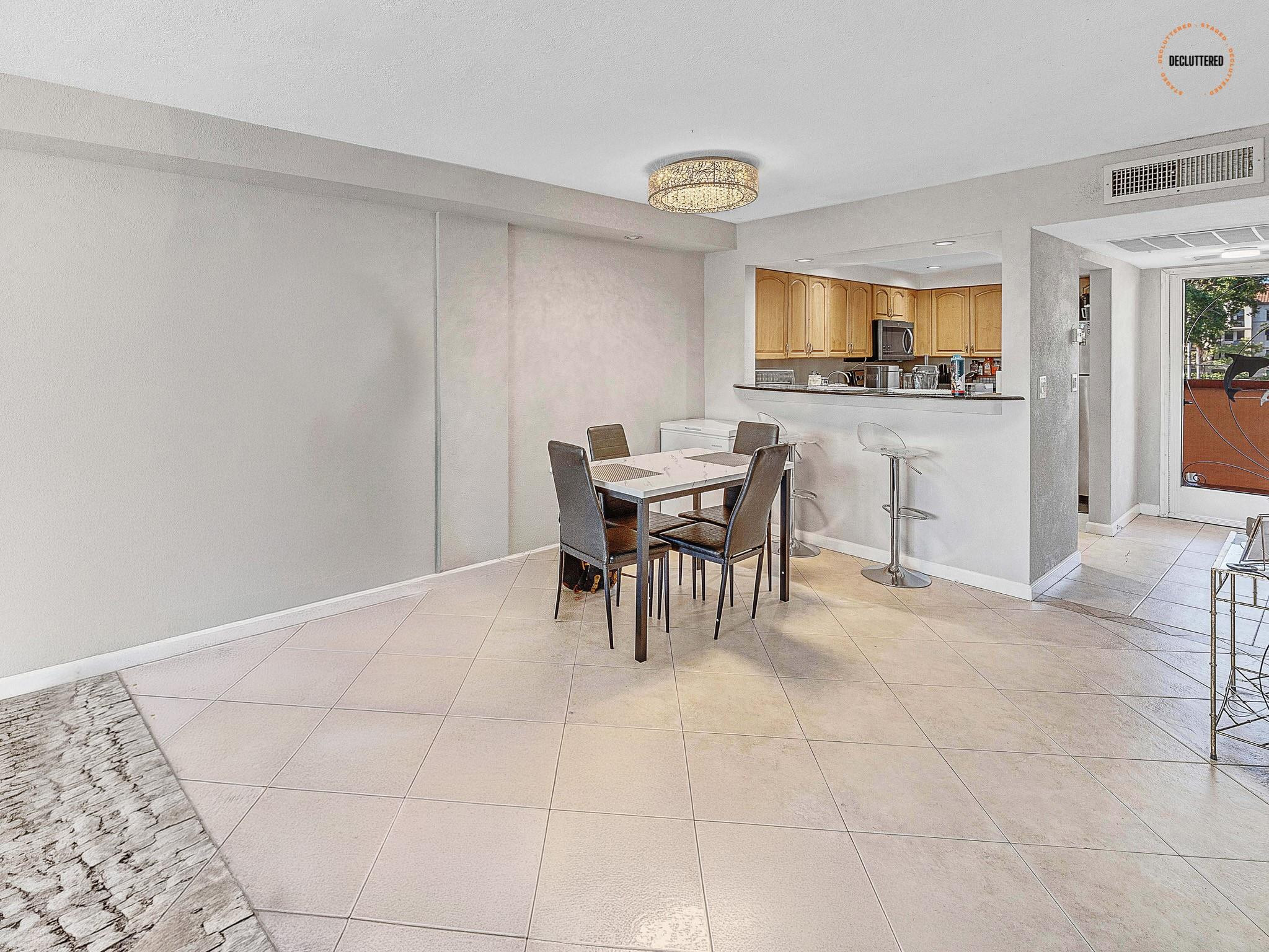 4500 North Federal Highway, Unit 303 Lighthouse Point, FL 33064 - Photo 29 of 40 a view of a dining room with furniture