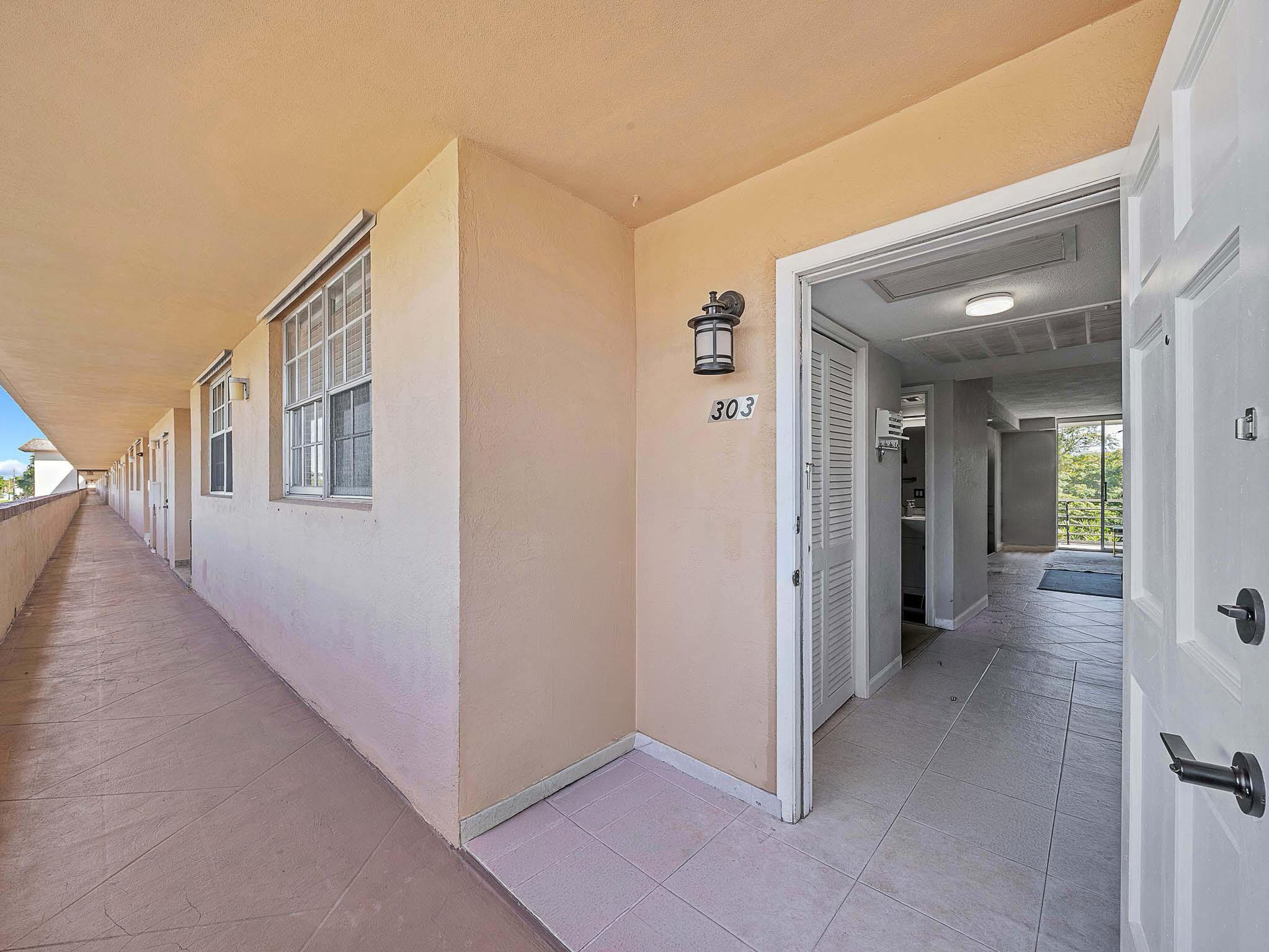 4500 North Federal Highway, Unit 303 Lighthouse Point, FL 33064 - Photo 7 of 40 a view of a hallway with closet area