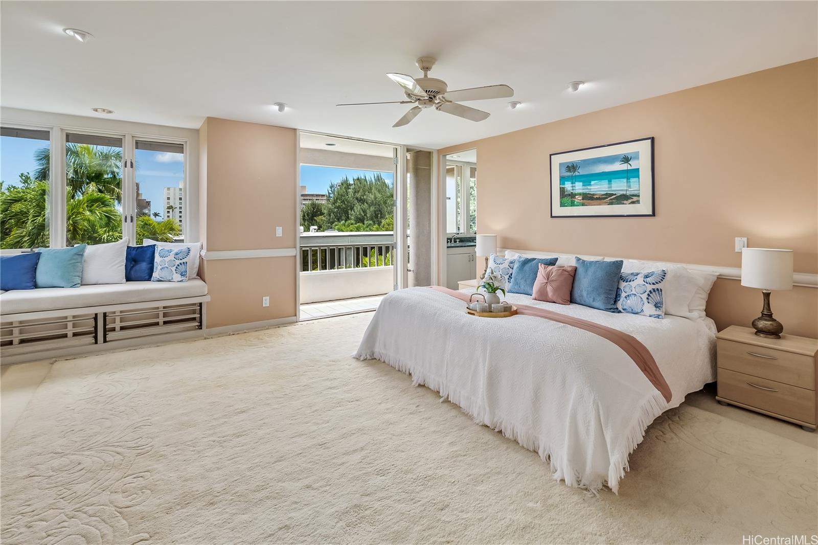 a spacious bedroom with a large bed and a couch