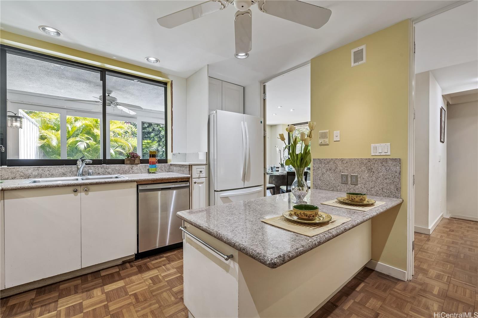 2929 Poni Moi Road, Unit 4 Honolulu, HI 96815 - Photo 14 of 25 a kitchen with stainless steel appliances granite countertop a sink and a refrigerator