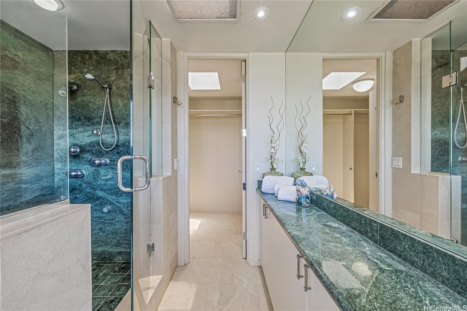 2929 Poni Moi Road, Unit 4 Honolulu, HI 96815 - Photo 17 of 25 a bathroom with a granite countertop sink mirror and shower