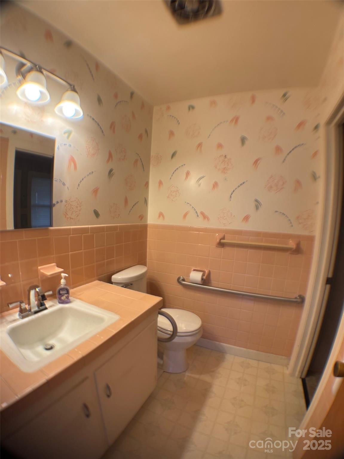 150 Old Georgia Road Statesville, NC 28625 - Photo 17 of 42 a bathroom with a sink a toilet and mirror