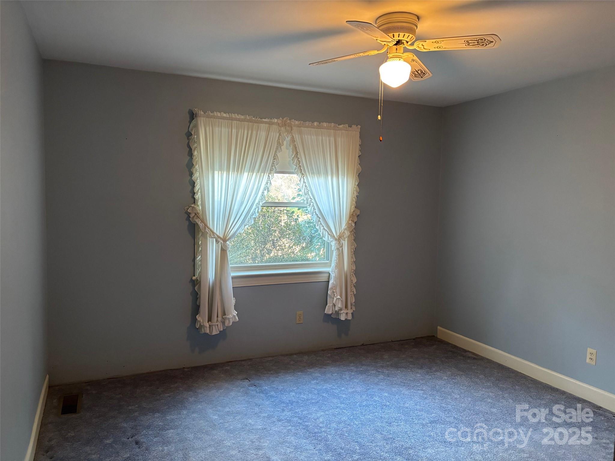 150 Old Georgia Road Statesville, NC 28625 - Photo 21 of 42 an empty room with windows and fan
