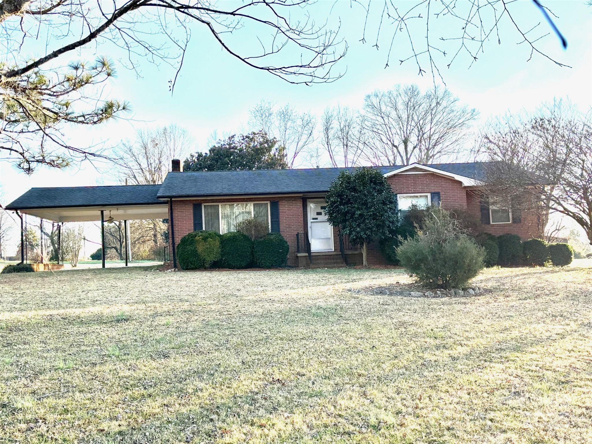 150 Old Georgia Road Statesville, NC 28625 - Photo 29 of 42 a front view of a house with a yard and garage