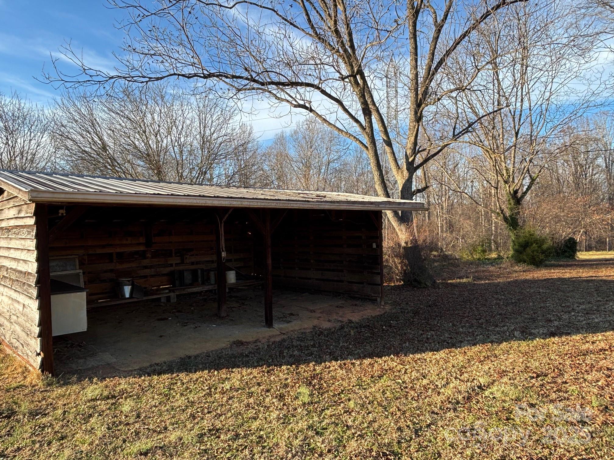 150 Old Georgia Road Statesville, NC 28625 - Photo 31 of 42 a view of backyard with wooden fence and large trees