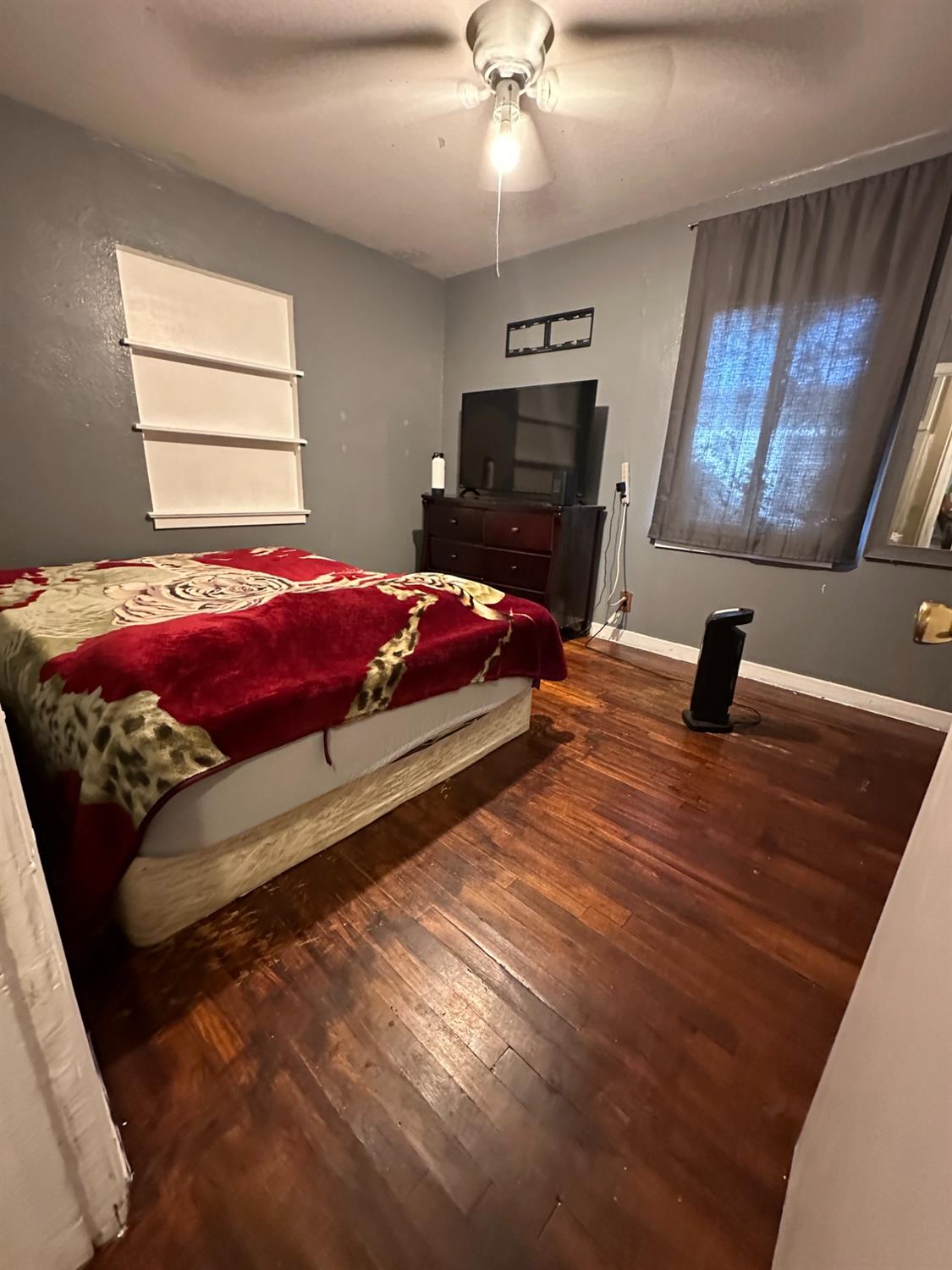 915 West Fountain Way Fresno, CA 93705 - Photo 11 of 20 a bedroom with bed and window