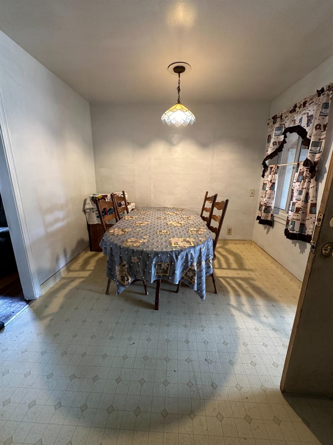 915 West Fountain Way Fresno, CA 93705 - Photo 17 of 20 a living room with furniture and chandelier