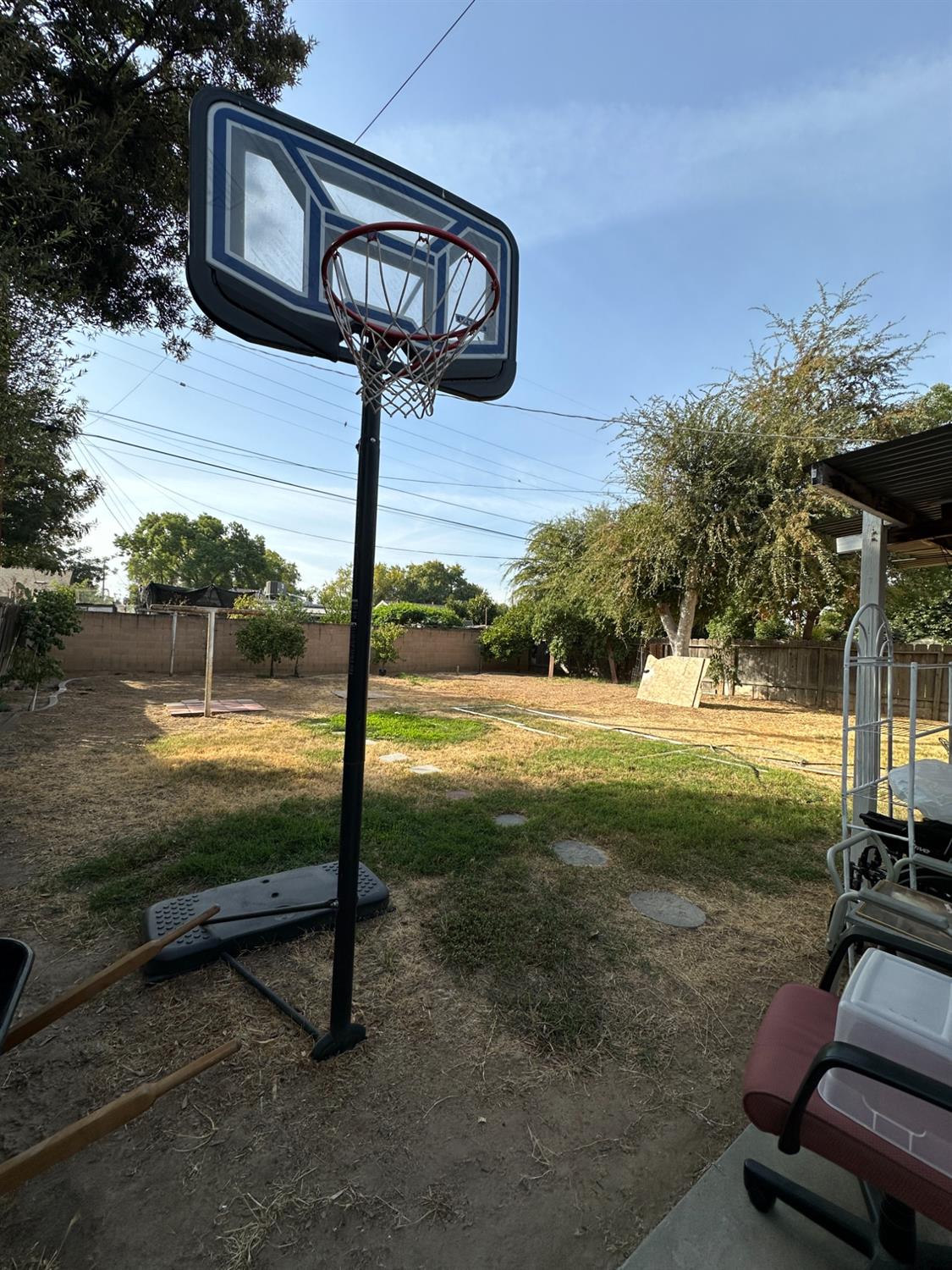 915 West Fountain Way Fresno, CA 93705 - Photo 19 of 20 a view of a bench in the patio next to a yard