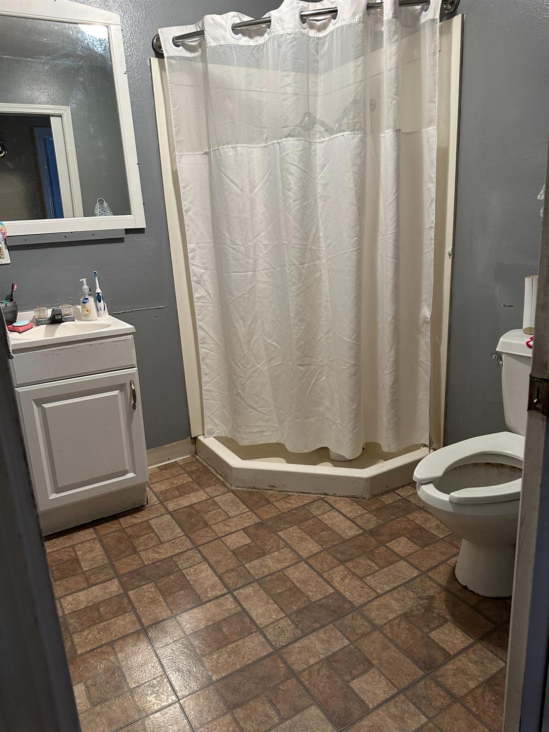 915 West Fountain Way Fresno, CA 93705 - Photo 6 of 20 a bathroom with a sink toilet and shower
