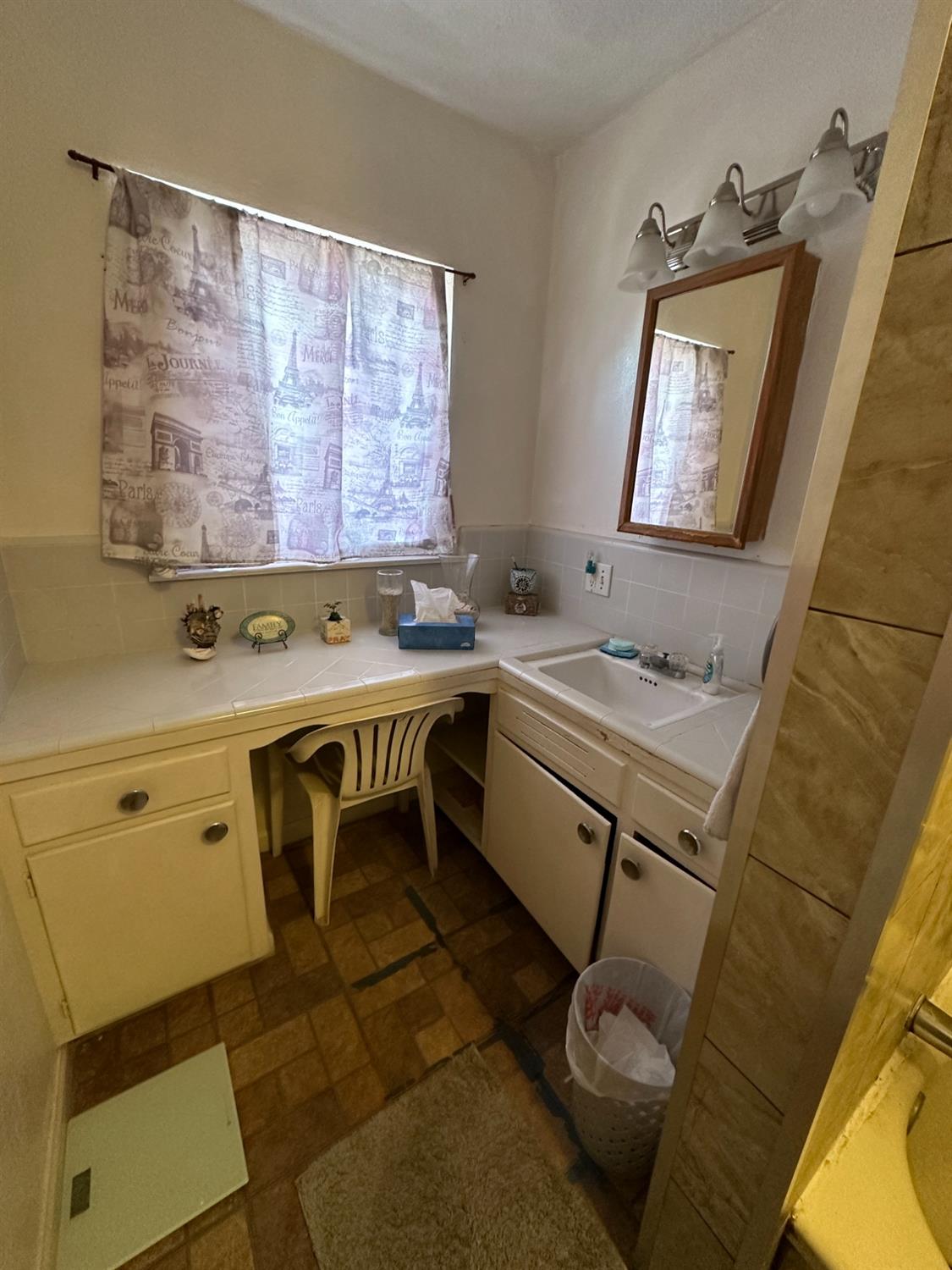 915 West Fountain Way Fresno, CA 93705 - Photo 8 of 20 a bathroom with a sink and a mirror