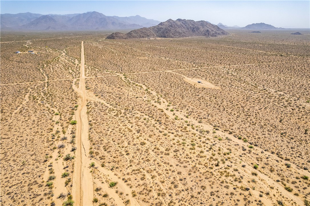 0 East Arroyo Road Yucca, AZ 86438 - Photo 8 of 25 Expansive desert landscape with visible mountains in the distance