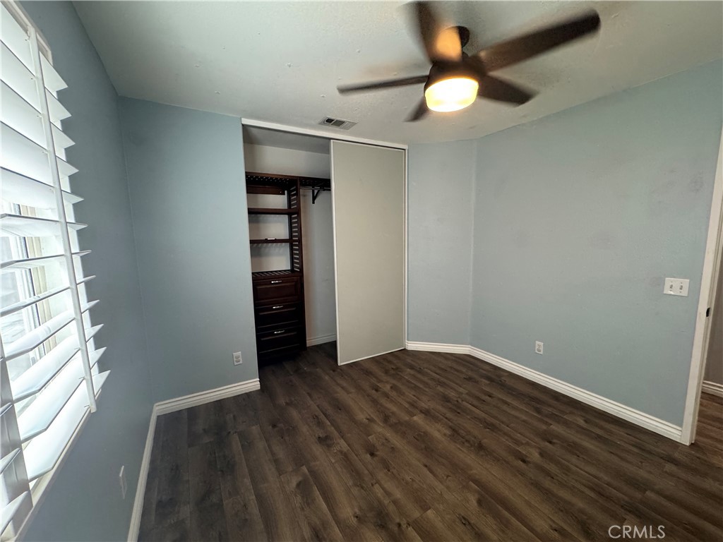 1517 Marigold Drive Perris, CA 92571 - Photo 13 of 47 wooden floor in an empty room with a window