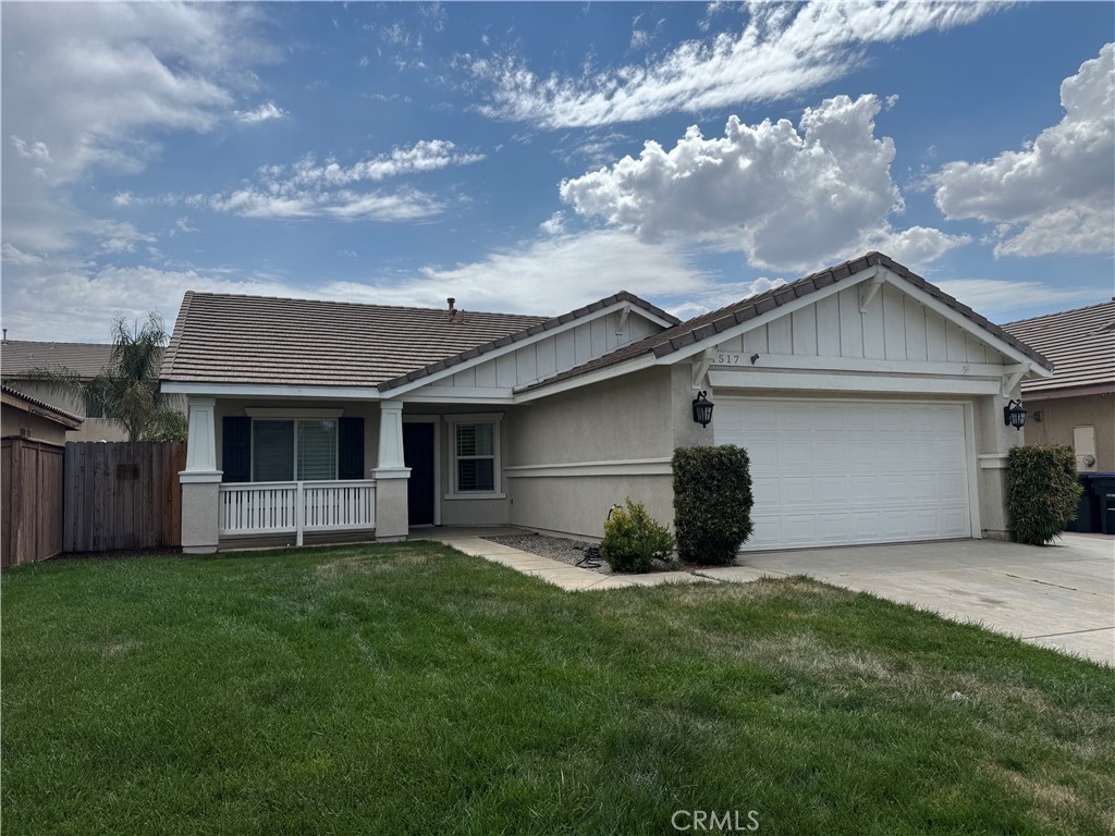 1517 Marigold Drive Perris, CA 92571 - Photo 2 of 47 a view of a house with a yard and a large tree