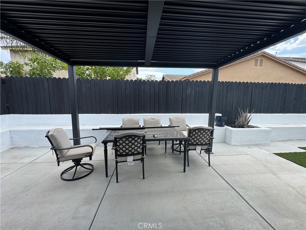 1517 Marigold Drive Perris, CA 92571 - Photo 43 of 47 a view of patio with table and chairs