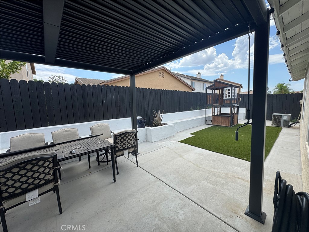 1517 Marigold Drive Perris, CA 92571 - Photo 47 of 47 a patio with table and chairs
