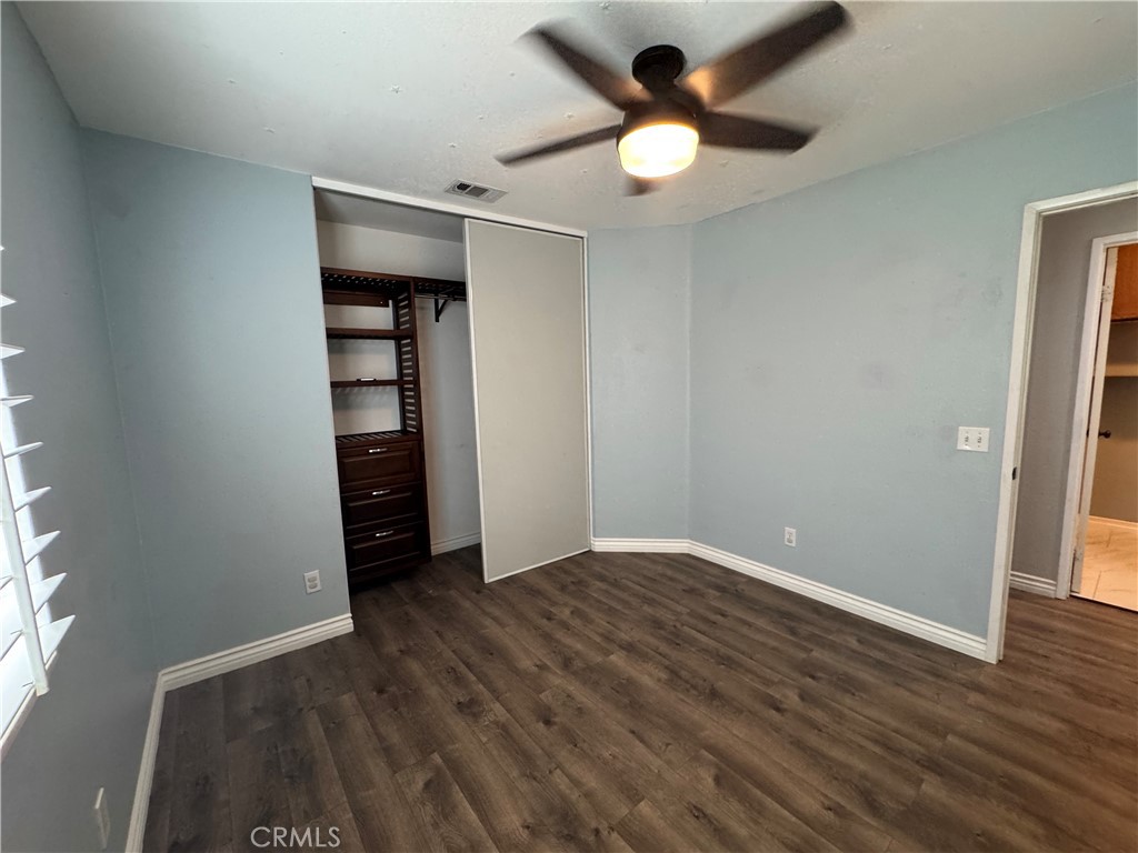 1517 Marigold Drive Perris, CA 92571 - Photo 7 of 47 an empty room with wooden floor and closet