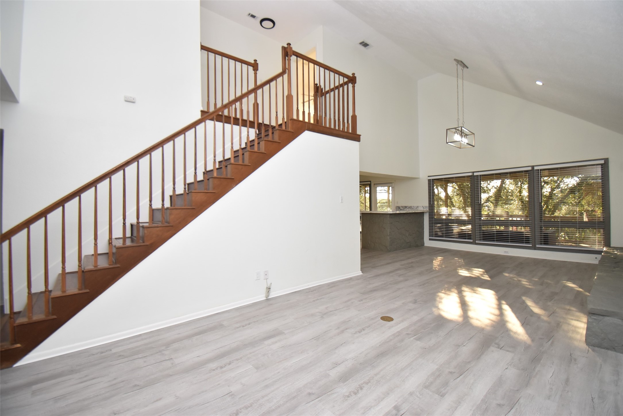 82 Harbor Lane Kemah, TX 77565 - Photo 19 of 33 a view of entryway and hall with wooden floor