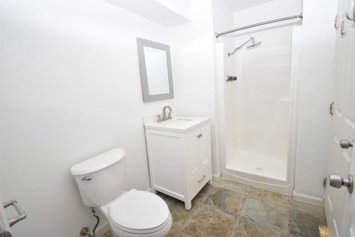 82 Harbor Lane Kemah, TX 77565 - Photo 27 of 33 a white toilet sitting next to a bathroom sink