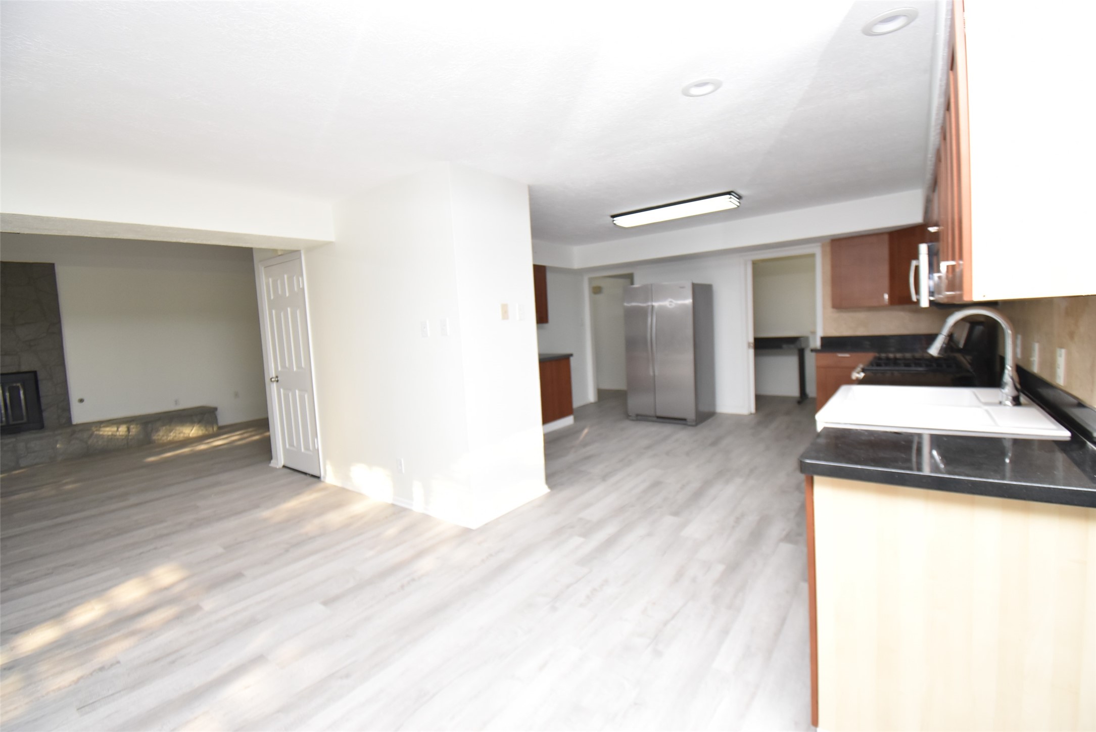 82 Harbor Lane Kemah, TX 77565 - Photo 7 of 33 a kitchen with a sink and a refrigerator