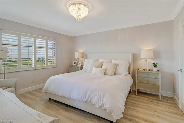 a bedroom with a bed and a table