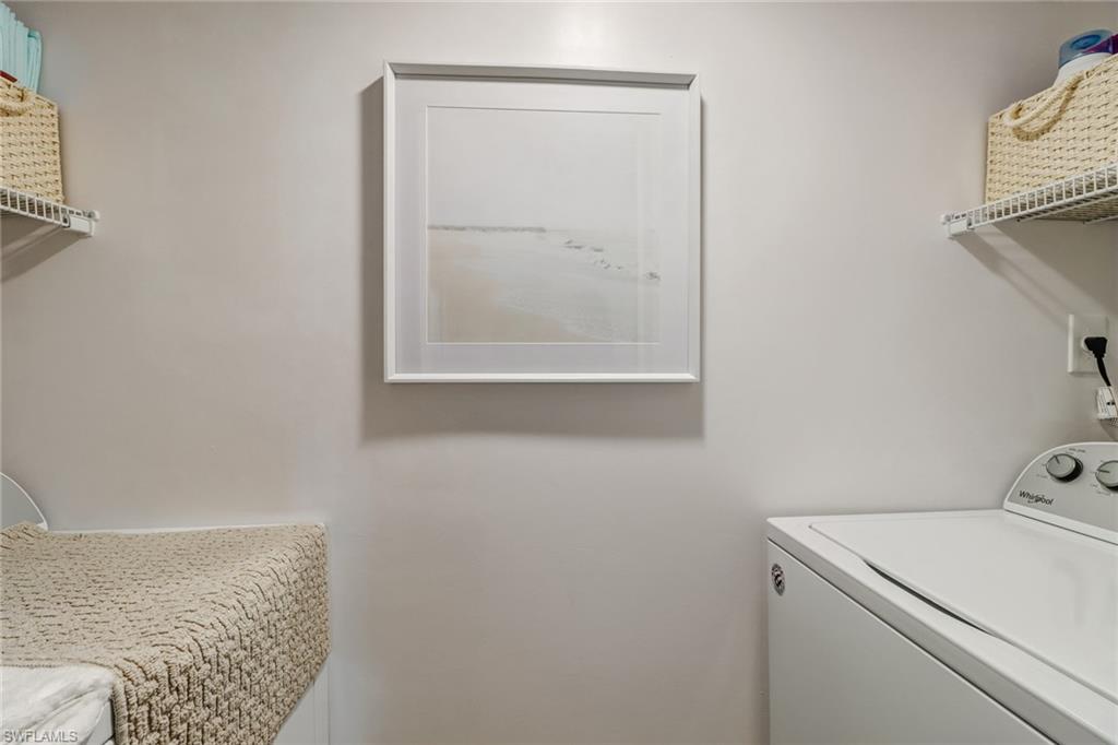 21 High Point Circle East, Unit 601 Naples, FL 34103 - Photo 20 of 22 a bathroom with a sink and a window