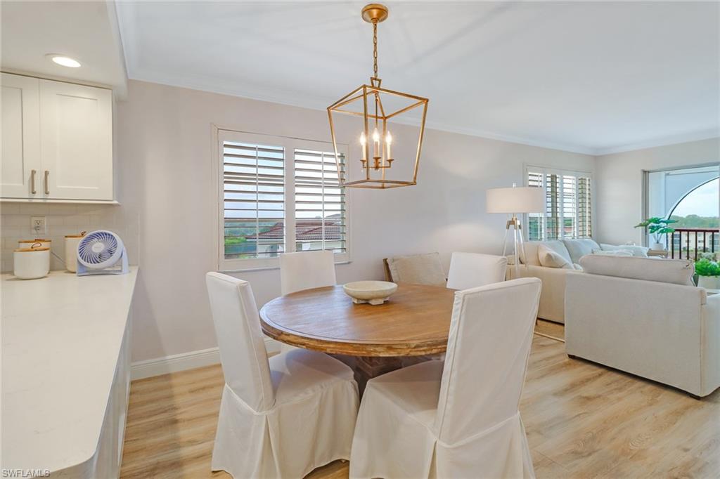 21 High Point Circle East, Unit 601 Naples, FL 34103 - Photo 4 of 22 a dining room with furniture and window