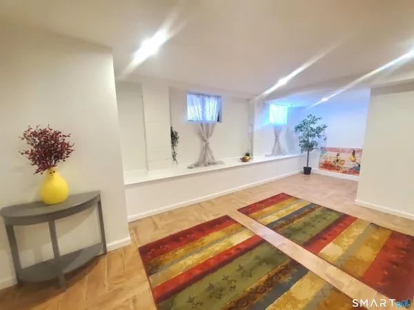 a living room with a rug