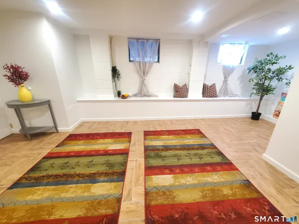 a living room with a rug