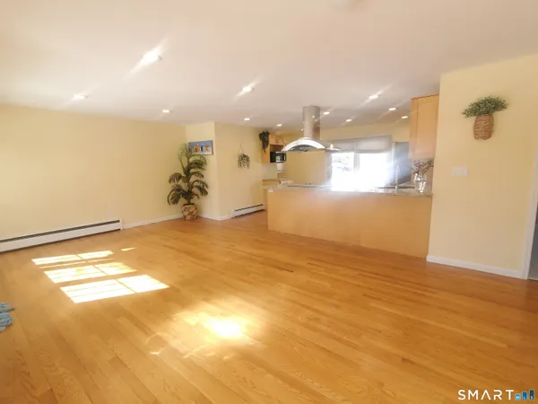 a view of a room with a kitchen